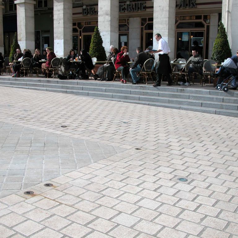 The image shows this product being used in a patio pavers application.