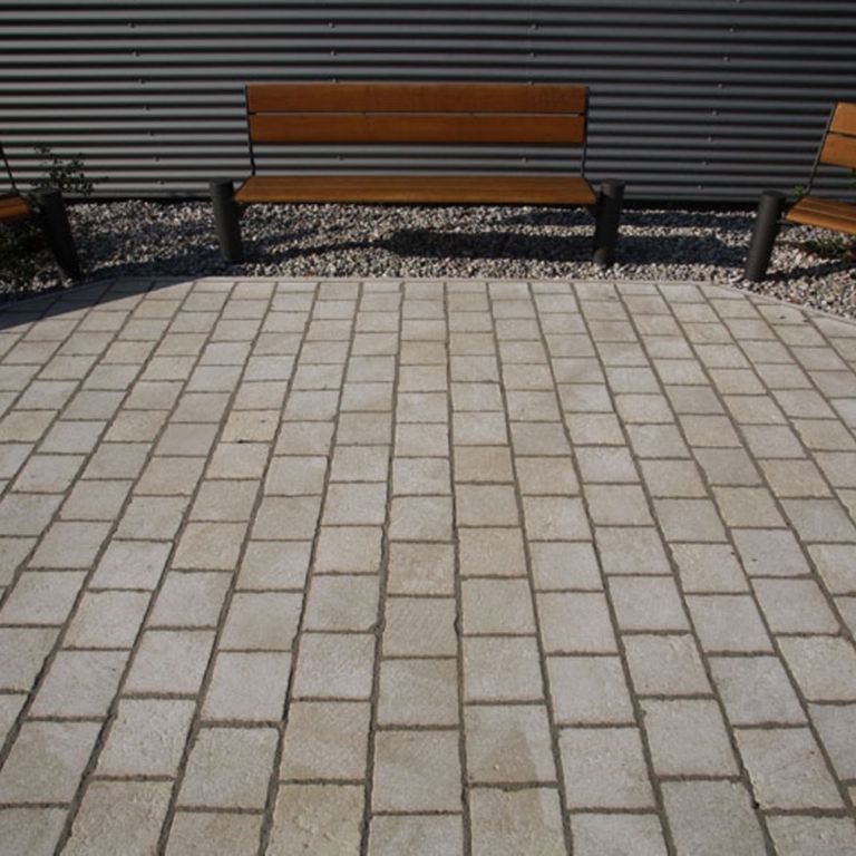 The image shows this product being used in a patio pavers application.