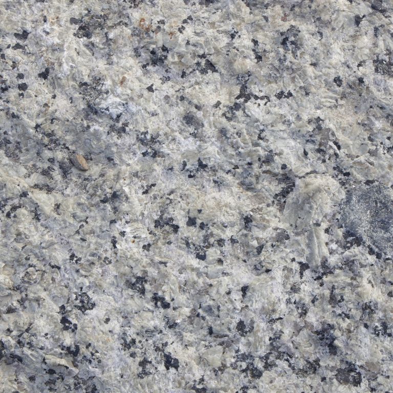 Color/Finish variation image for Reclaimed First Generation Granite Curbstone Plank Pavers. The dominant color shown is gray; with beige, blue, purple and white secondaries. The color mix creates a cool feeling. Coarse speckled, blotched and cloudy color patterns.