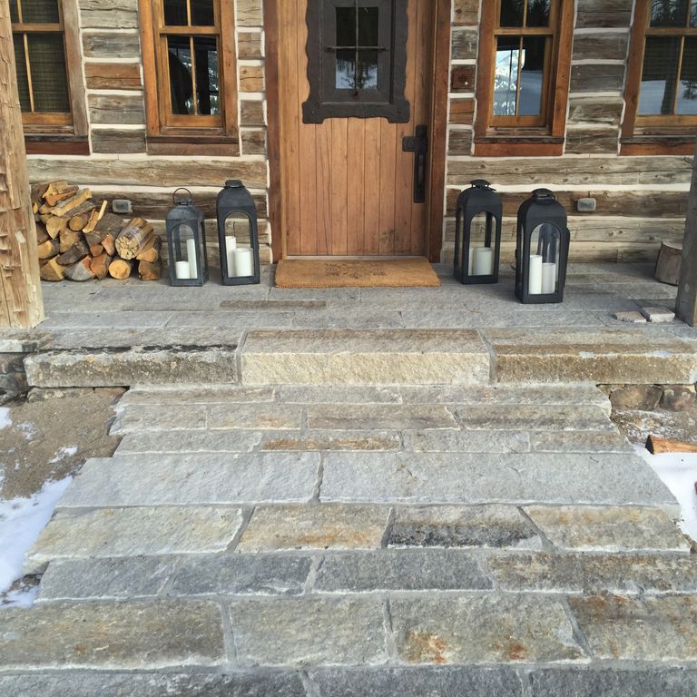 Feature image for Granite - Reclaimed Second Generation Curbstone - Plank Pavers. The image shows this product being used for path pavers and patio pavers. The surface finish shown is . The dominant color shown is gray. The color mix creates a warm feeling.