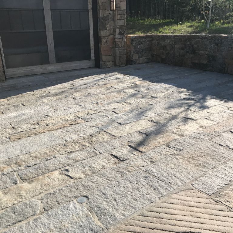 The image shows this product being used in a patio pavers application.