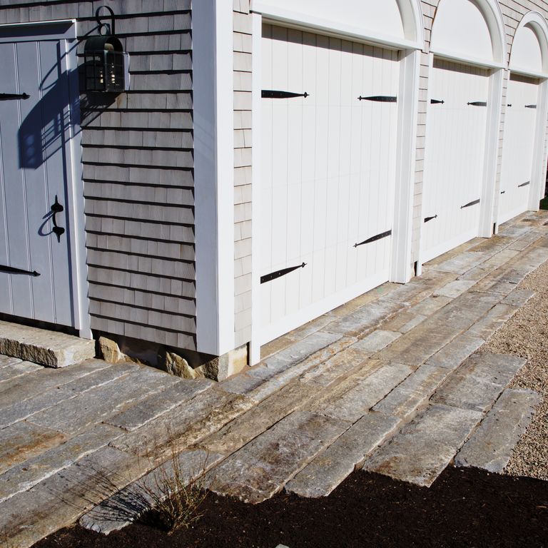 The image shows this product being used for driveway pavers and driveway aprons.
