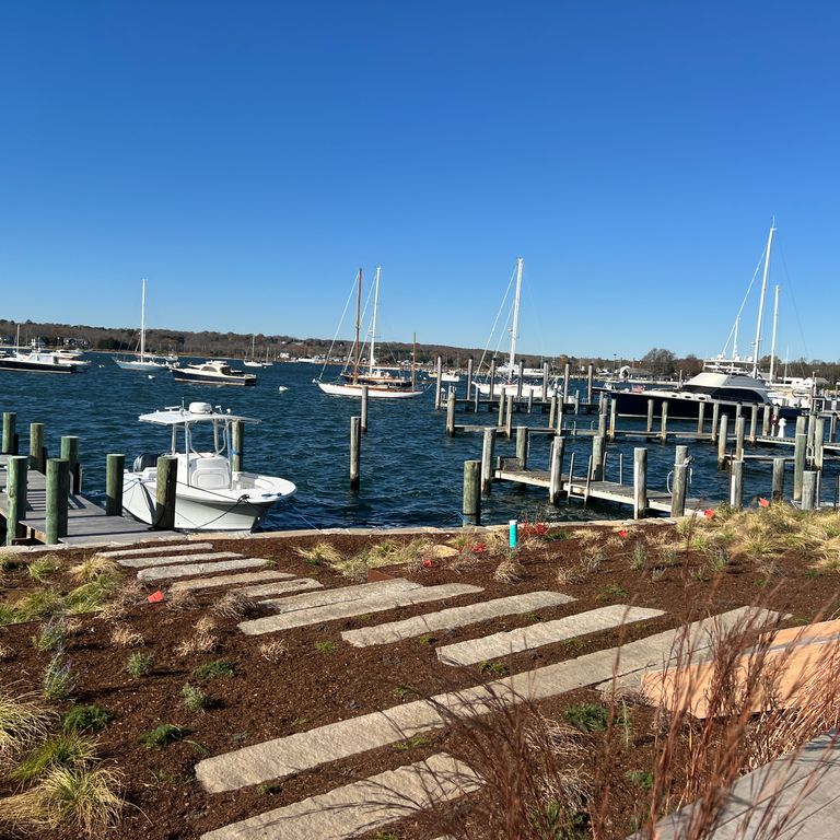 Application image for Granite - Reclaimed Third Generation Curbstone - Plank Pavers. The image shows this product being used in a path pavers application. Dominant colors shown are gray and tan. The color mix creates a warm feeling.