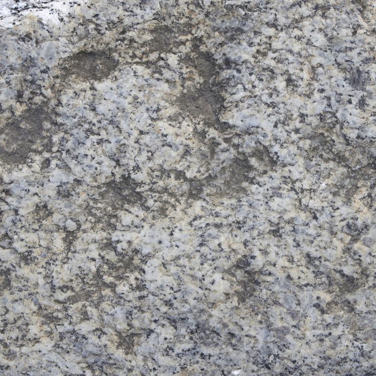 Color/Finish variation image for Reclaimed First Generation Granite Curbstone Edging. The dominant color shown is gray; with beige, blue, brown, green and white secondaries. Exhibits 