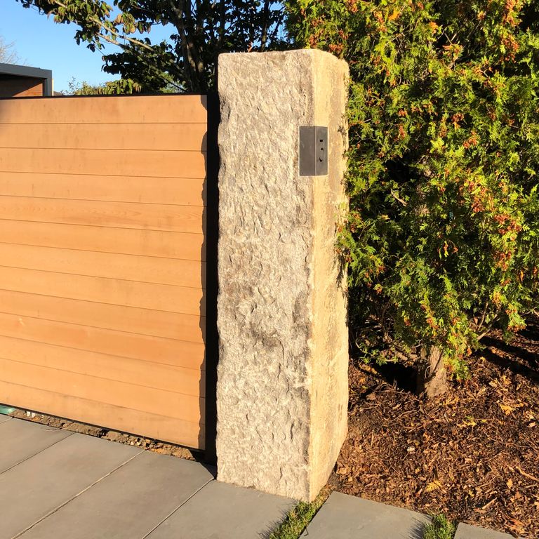 Application image for Reclaimed Granite - Columns. The image shows this product being used in a columns application. The dominant color shown is gray.