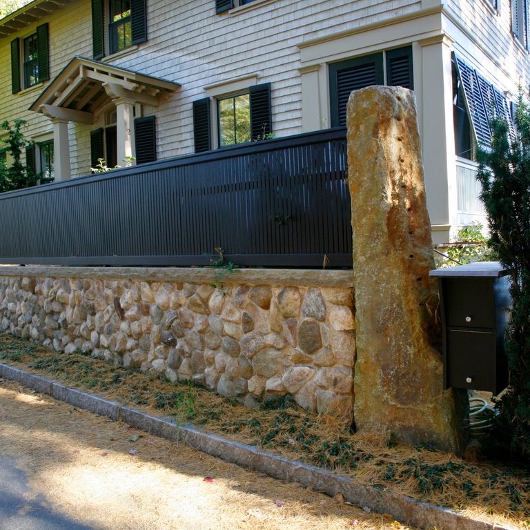 Application image for Reclaimed Granite Columns. The image shows this product being used in a columns application. This is a landscape stone for outdoor commercial and residential applications. Suitable for general use situations. Moderate to high on the price spectrum.