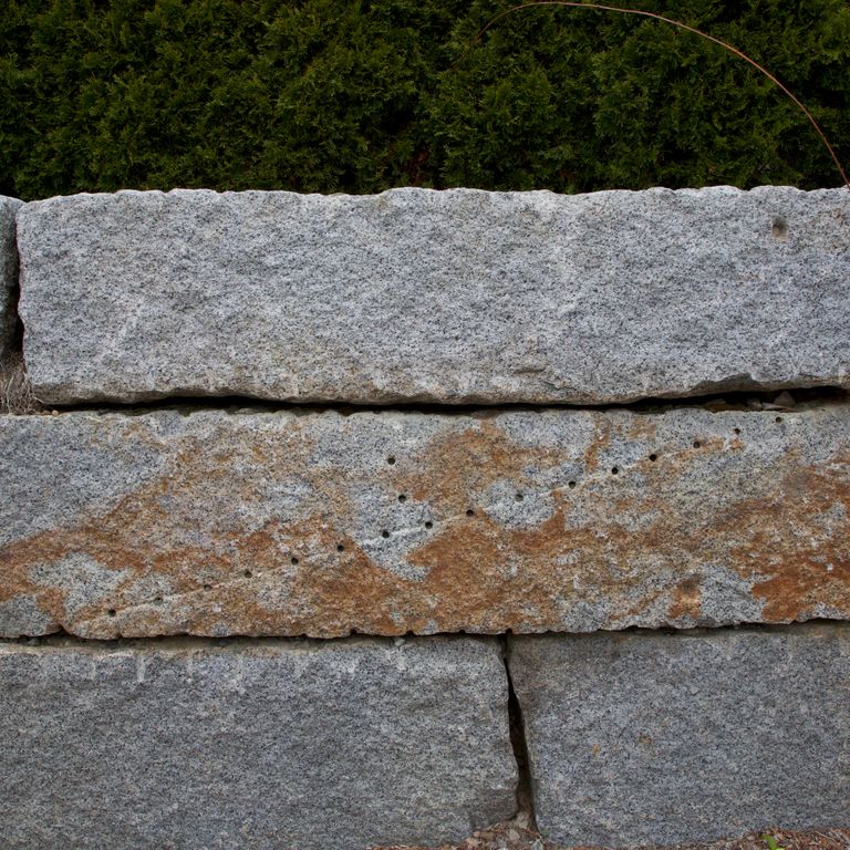 The image shows this product being used in a landscape wallstone application.