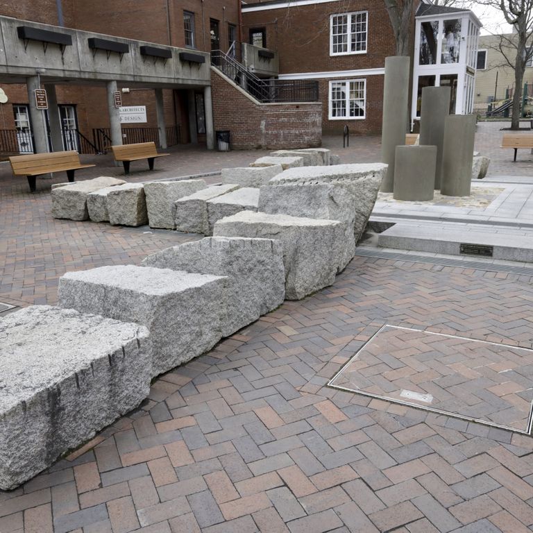 Application image for Granite - Reclaimed Block - Benches. The image shows this product being used in a seating & benches application. This is a landscape stone for outdoor commercial and residential applications. Suitable for general use, freeze-thaw conditions, low heat absorption surfaces and low slipperiness surfaces situations. Relatively higher in price.