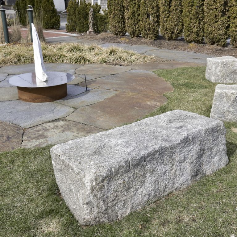 Application image for Granite - Reclaimed Block - Benches. The image shows this product being used in a seating & benches application. The dominant color shown is gray.