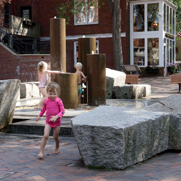 Application image for Granite - Reclaimed Block - Benches. The image shows this product being used in a seating & benches application. This is a landscape stone for outdoor commercial and residential applications. Suitable for general use, freeze-thaw conditions, low heat absorption surfaces and low slipperiness surfaces situations. Relatively higher in price.