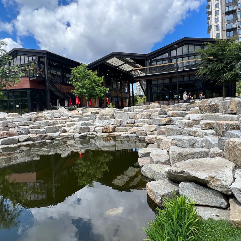 Application image for Granite - Reclaimed Block - Benches. The image shows this product being used in a seating & benches application. The dominant color shown is gray. The color mix creates a warm feeling.