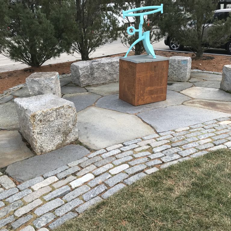 Application image for Granite - Reclaimed Block - Benches. The image shows this product being used in a seating & benches application. This is a landscape stone for outdoor commercial and residential applications. Suitable for general use, freeze-thaw conditions, low heat absorption surfaces and low slipperiness surfaces situations. Relatively higher in price.