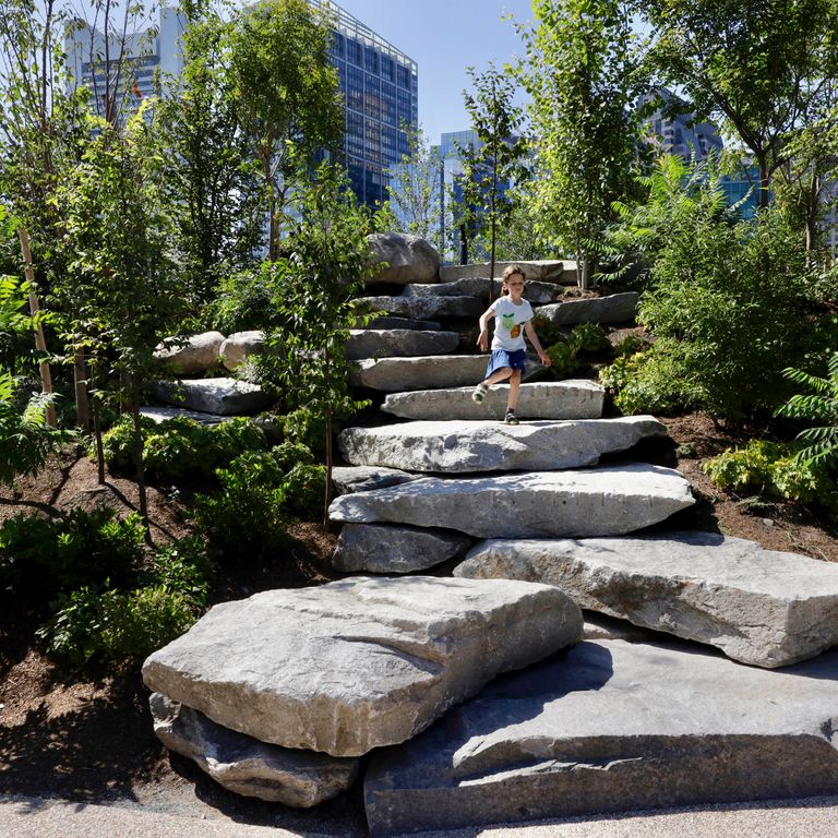 Application image for Reclaimed New England Granite Quarry Tailings - Steps and Landings. The image shows this product being used for landings and monolithic steps. This is a landscape stone for outdoor commercial and residential applications. Suitable for general use, freeze-thaw conditions, low heat absorption surfaces, high traffic areas, low slipperiness surfaces and high heel compatibilty situations. Higher to high on the price spectrum.