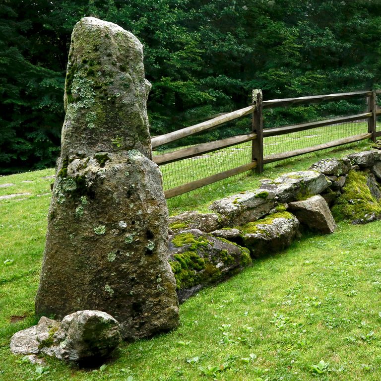 Application image for Reclaimed New England Granite Quarry Tailings - Megaliths and Standing Stones. The image shows this product being used in a megaliths application. This is a landscape stone for outdoor commercial and residential applications. Suitable for general use and freeze-thaw conditions situations. Higher to high on the price spectrum.