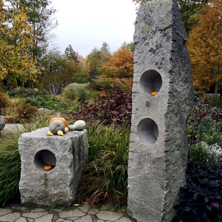 Application image for Reclaimed New England Granite Quarry Tailings - Megaliths and Standing Stones. The image shows this product being used in a megaliths application. This is a landscape stone for outdoor commercial and residential applications. Suitable for general use and freeze-thaw conditions situations. Higher to high on the price spectrum.