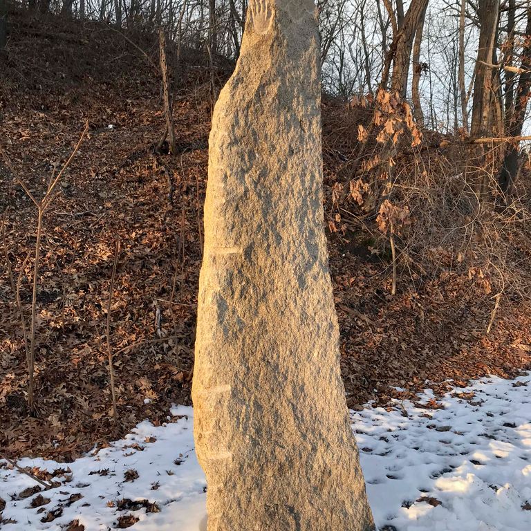 Application image for Reclaimed New England Granite Quarry Tailings - Megaliths and Standing Stones. The image shows this product being used in a megaliths application. This is a landscape stone for outdoor commercial and residential applications. Suitable for general use and freeze-thaw conditions situations. Higher to high on the price spectrum.