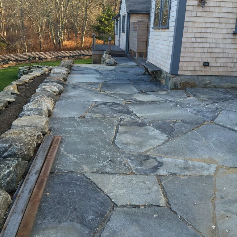 The image shows this product being used in a patio pavers application.