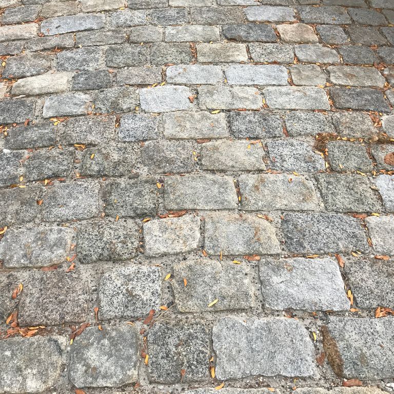 The image shows this product being used in a driveway pavers application.