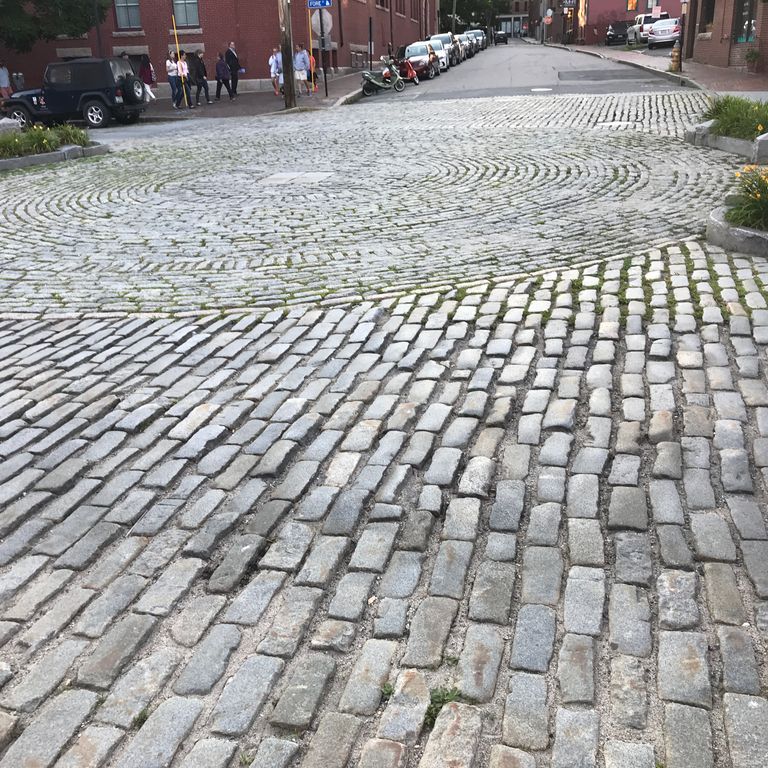 The image shows this product being used in a driveway pavers application.