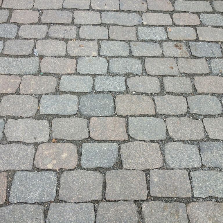 Application image for Reclaimed Swedish Granite Cobblestones - Flat Surface. The surface finish shown is sawn. The dominant color shown is gray.