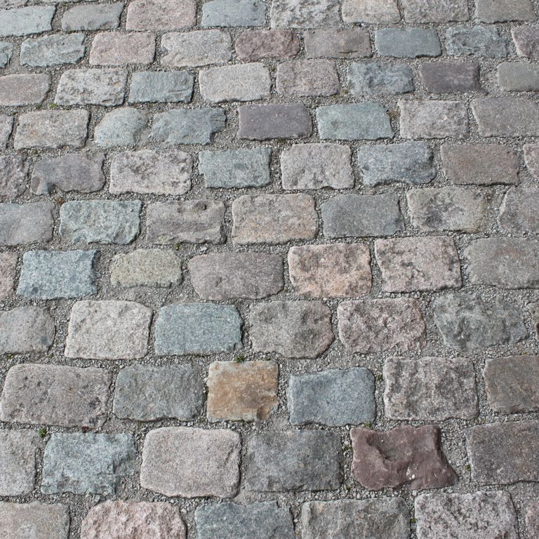 Application image for Reclaimed European Porphyry Cobblestones - Rectangle - Worn Surface. The surface finish shown is . The dominant color shown is gray. The color mix creates a cool feeling.