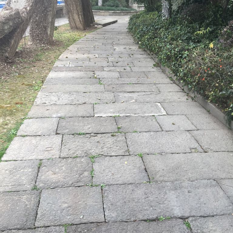 The image shows this product being used in a path pavers application.
