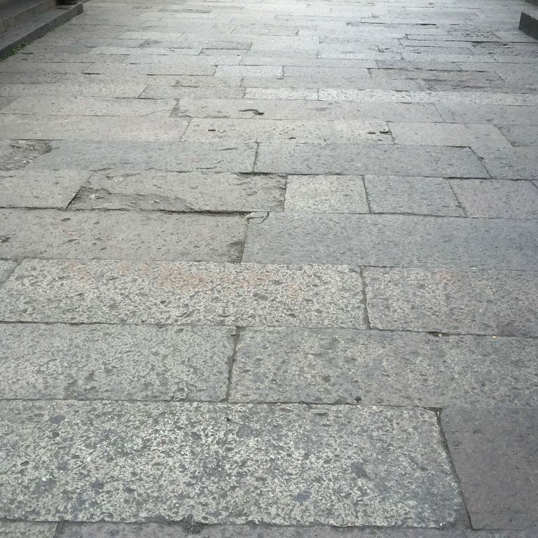 The image shows this product being used in a patio pavers application.
