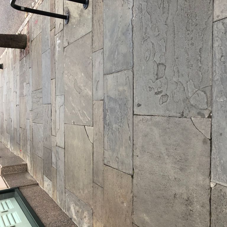 Application image for Reclaimed Bluestone Sidewalk Stones - Antique Surface. The image shows this product being used in a path pavers application. The surface finish shown is antiqued. The dominant color shown is gray. The color mix creates a warm feeling.