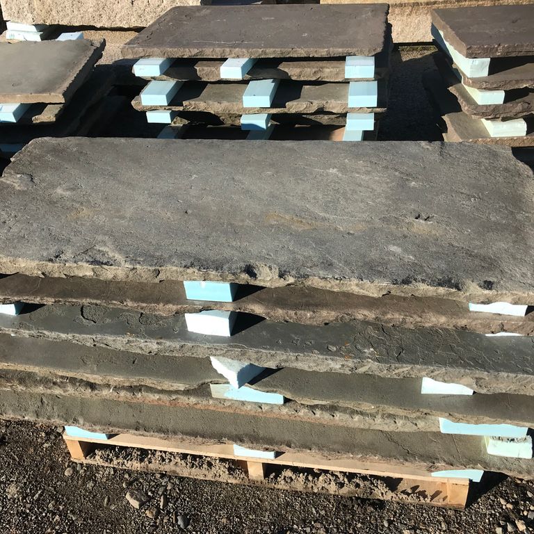 Application image for Reclaimed Bluestone Sidewalk Stones. The surface finish shown is natural cleft. The dominant color shown is gray. The color mix creates a warm feeling.