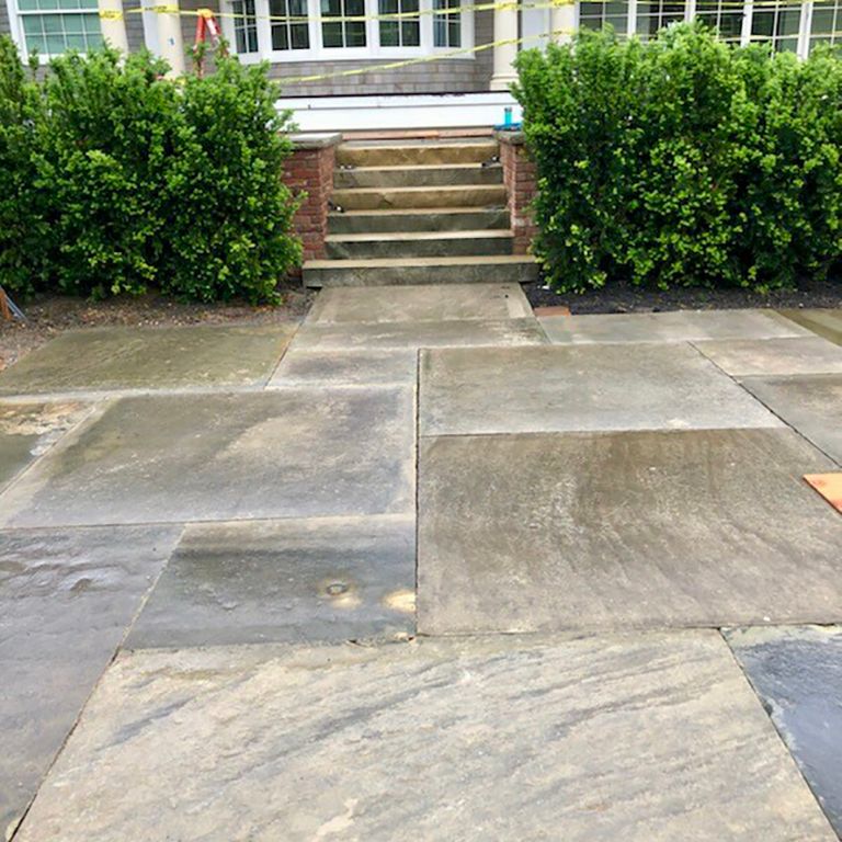 The image shows this product being used in a patio pavers application.