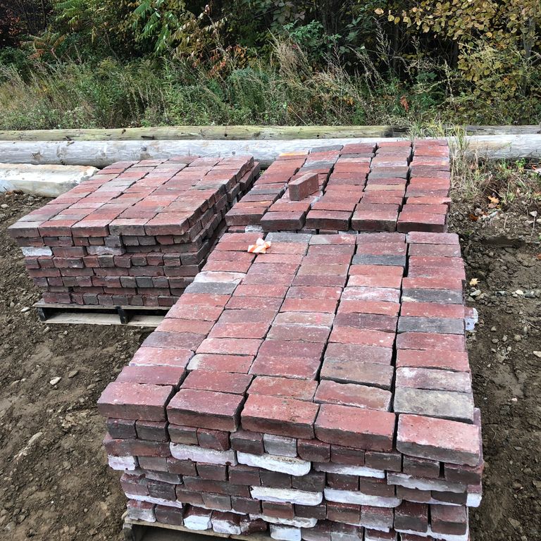 Application image for Brick- Reclaimed Boston Pavers. The surface finish shown is . Dominant colors shown are gray, pink and red. The color mix creates a warm feeling. Regular color pattern.