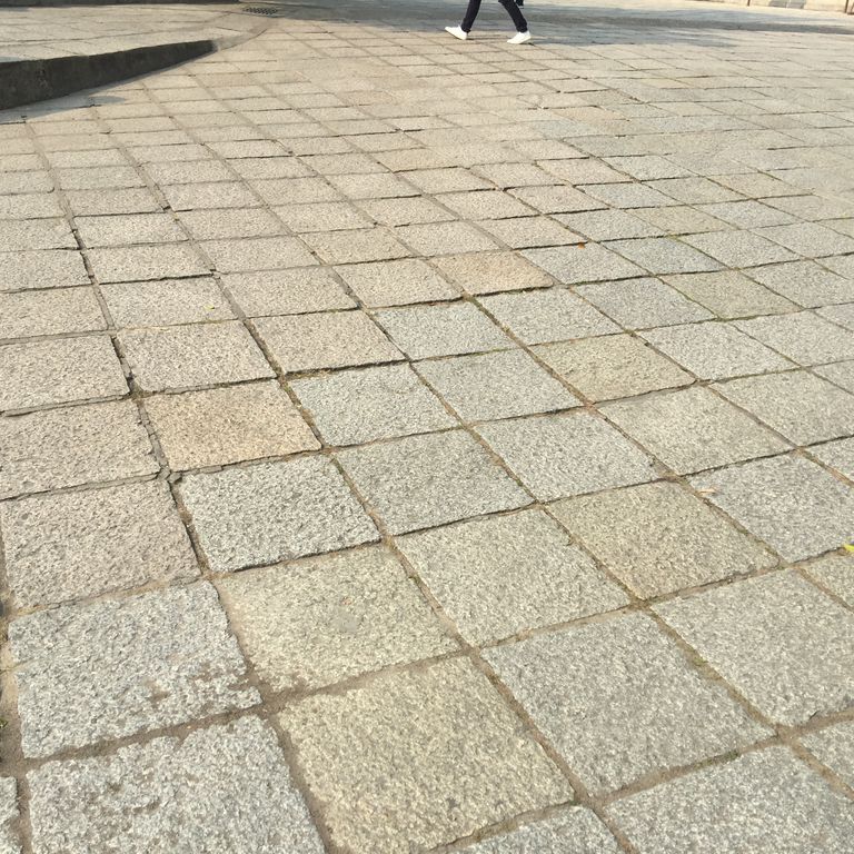 Application image for Reclaimed Granite Pavers - Squares. The surface finish shown is . Dominant colors shown are beige and tan. Regular and speckled color patterns.