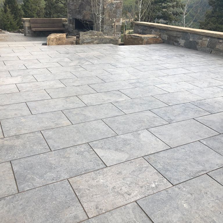 The image shows this product being used in a patio pavers application.