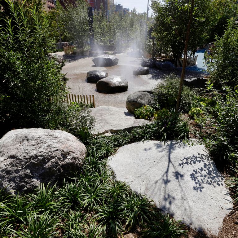Application image for New England Fieldstone Boulders & Ledgestone - Fountains & Lights. The image shows this product being used for water features and garden accents. The surface finish shown is weathered. The dominant color shown is gray. The color mix creates a warm feeling.