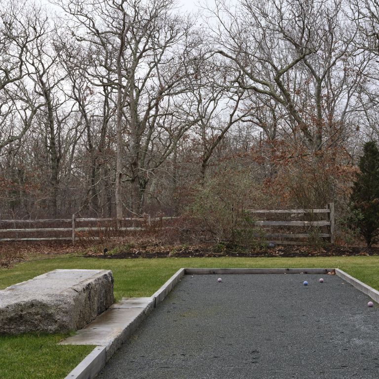 Application image for Reclaimed Granite Bridge Blocks - Benches and Seating. The image shows this product being used in a seating & benches application. The surface finish shown is . Dominant colors shown are brown and gray. The color mix creates a warm feeling. Regular and speckled color patterns.