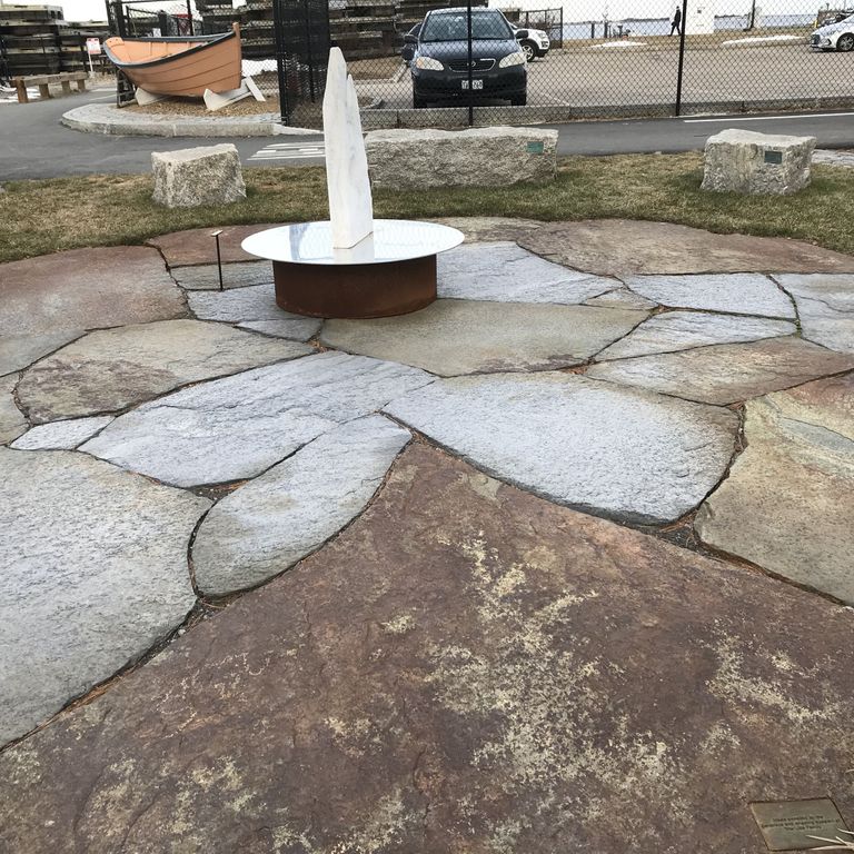 Application image for Goshen Stone - Irregular Flagstone. The image shows this product being used in a patio pavers application. The surface finish shown is split-face with flat plane. Dominant colors shown are brown and gray. The color mix creates a warm feeling. Regular and blotched color patterns. Contains lots of mica and mineral inclusions.