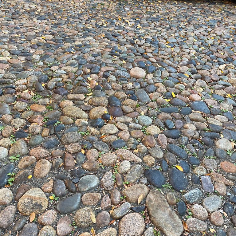 The image shows this product being used in a driveway pavers application.