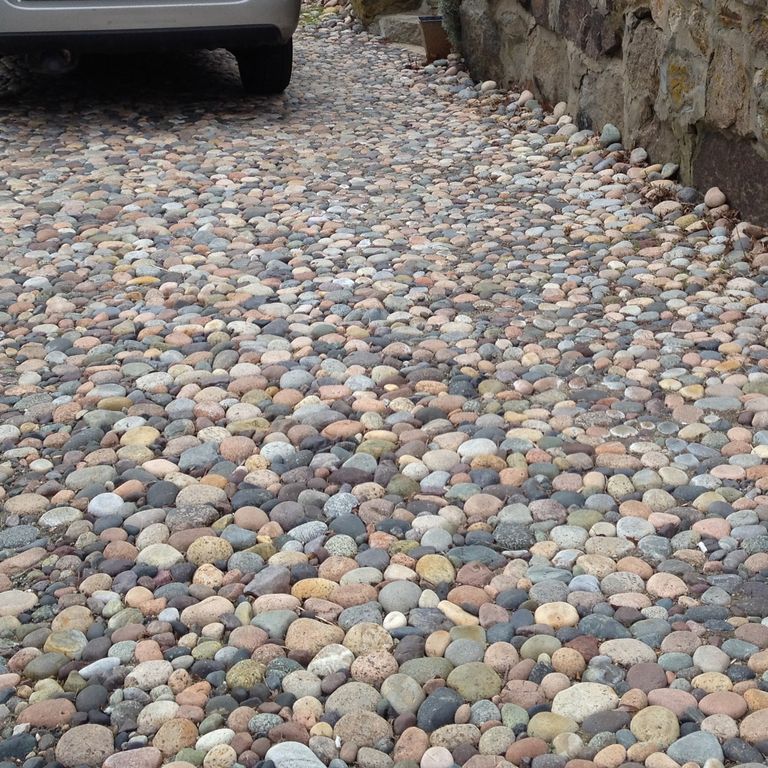 The image shows this product being used in a driveway pavers application.