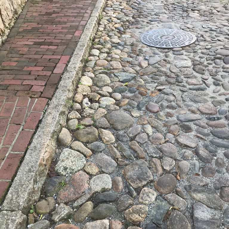 The image shows this product being used in a driveway pavers application.