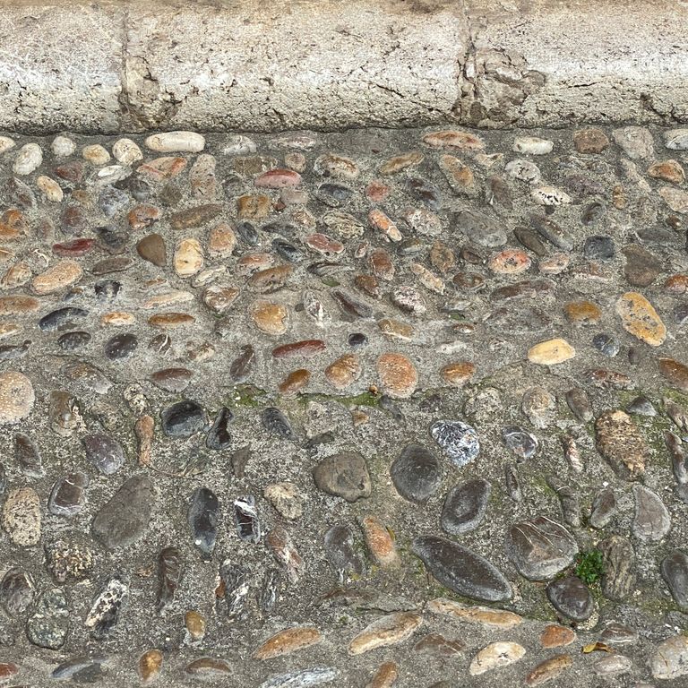 The image shows this product being used in a driveway pavers application.
