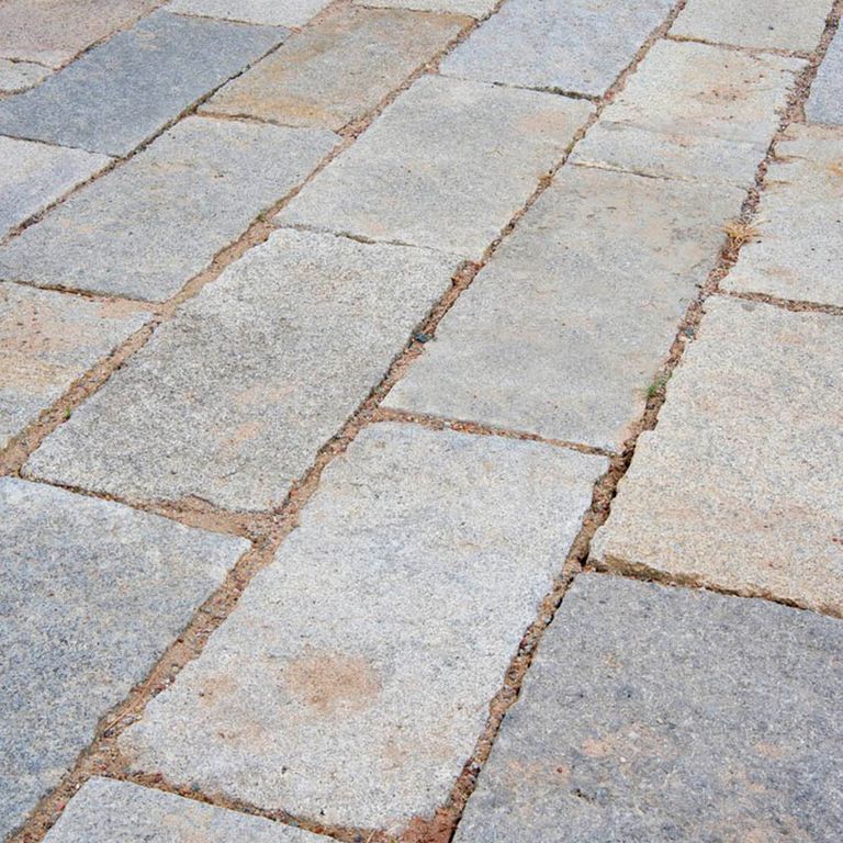 The image shows this product being used in a patio pavers application.