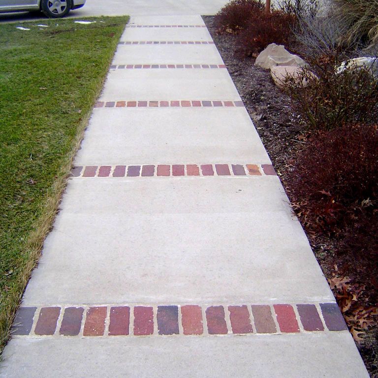 The image shows this product being used in a path pavers application.