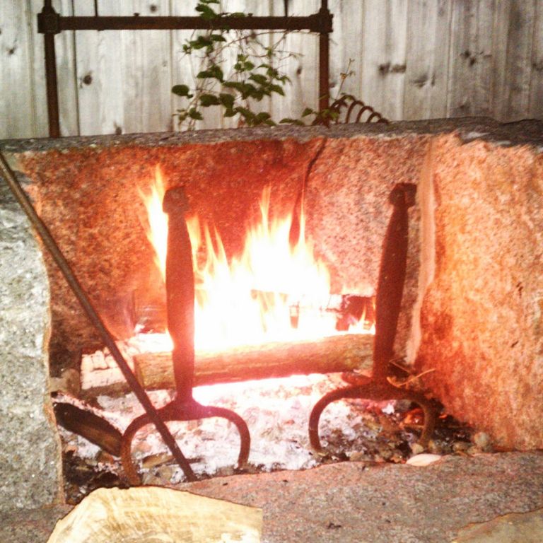 Application image for Reclaimed Granite Fire Feature. The image shows this product being used in an outdoor fire concepts application. This is a building and landscape stone for indoor and outdoor residential applications. Suitable for general use situations. Higher to high on the price spectrum.