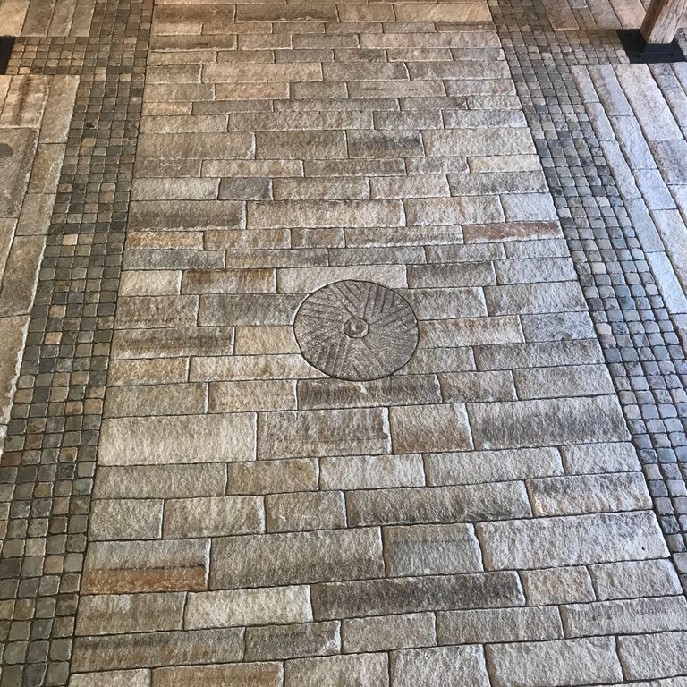 The image shows this product being used in a driveway pavers application.