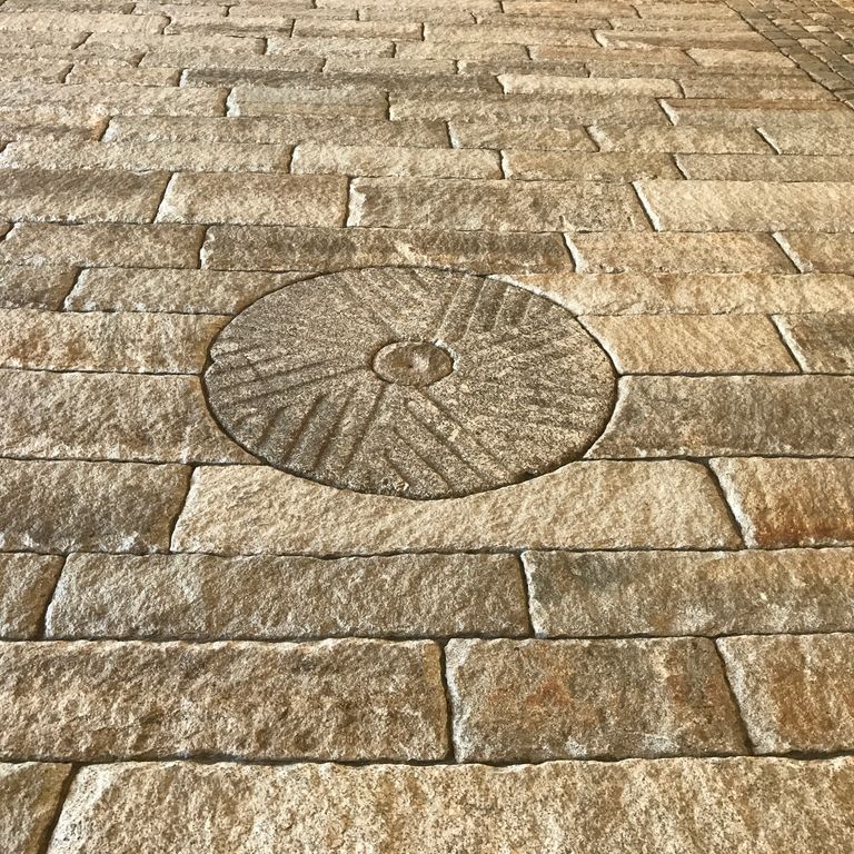 The image shows this product being used in a driveway pavers application.
