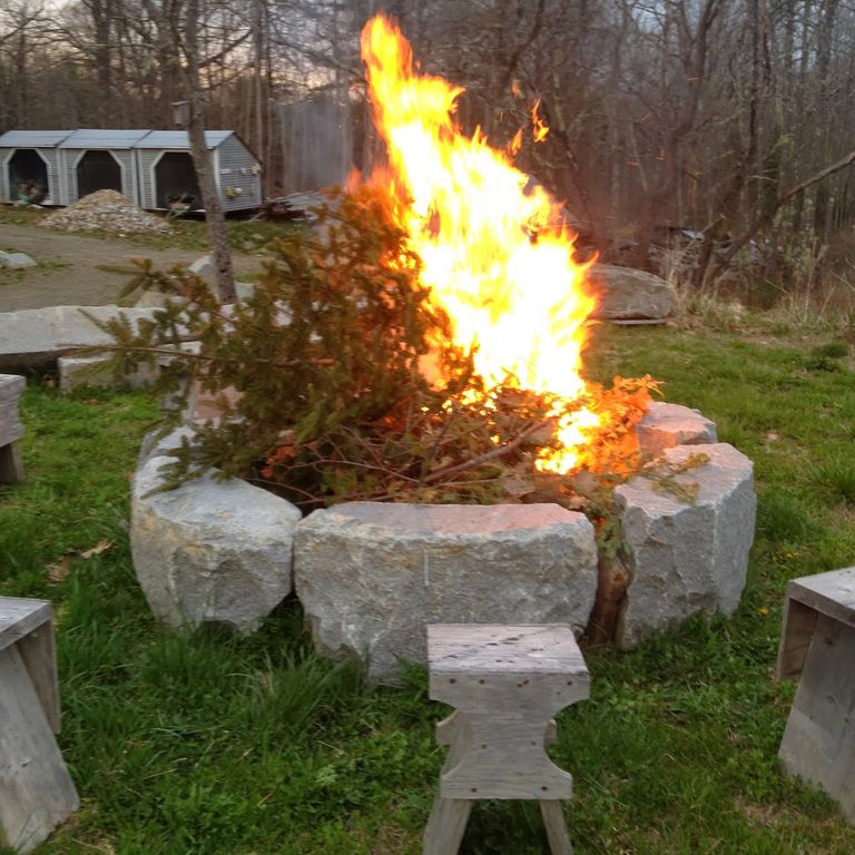 Application image for Reclaimed D-Radius Curbstone Fire Pit. The image shows this product being used in a garden accents application. This is a landscape stone for outdoor residential applications. Suitable for general use, freeze-thaw conditions and low heat absorption surfaces situations. Relatively higher in price.