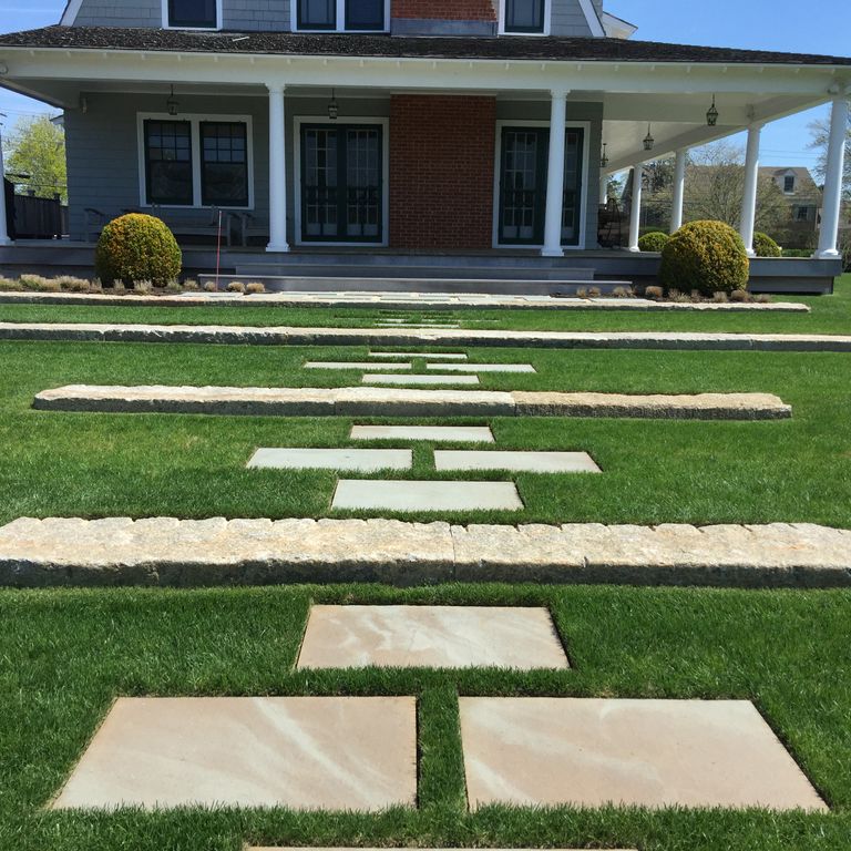 Application image for Reclaimed First Generation Granite Curbstone - Lawn Steps. The image shows this product being used in a monolithic steps application. This is a building and landscape stone for outdoor commercial and residential applications. Suitable for general use, freeze-thaw conditions, low heat absorption surfaces, high traffic areas and low slipperiness surfaces situations. Moderate to higher on the price spectrum.