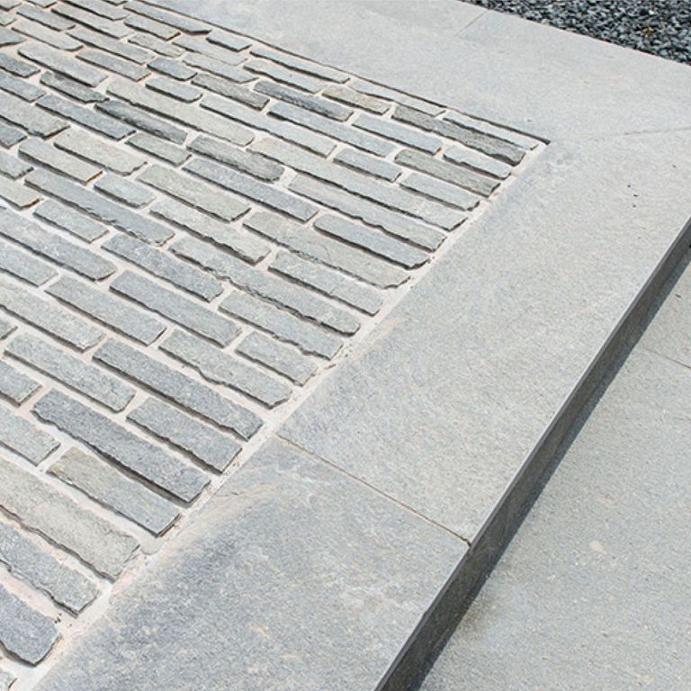 The image shows this product being used in a path pavers application.
