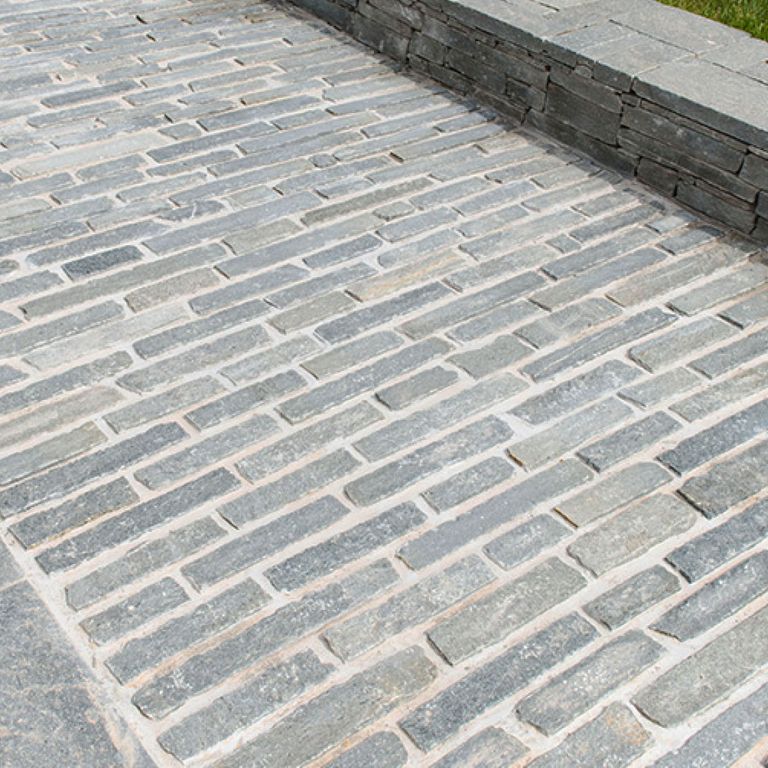 The image shows this product being used in a path pavers application.