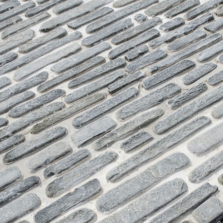 The image shows this product being used in a path pavers application.